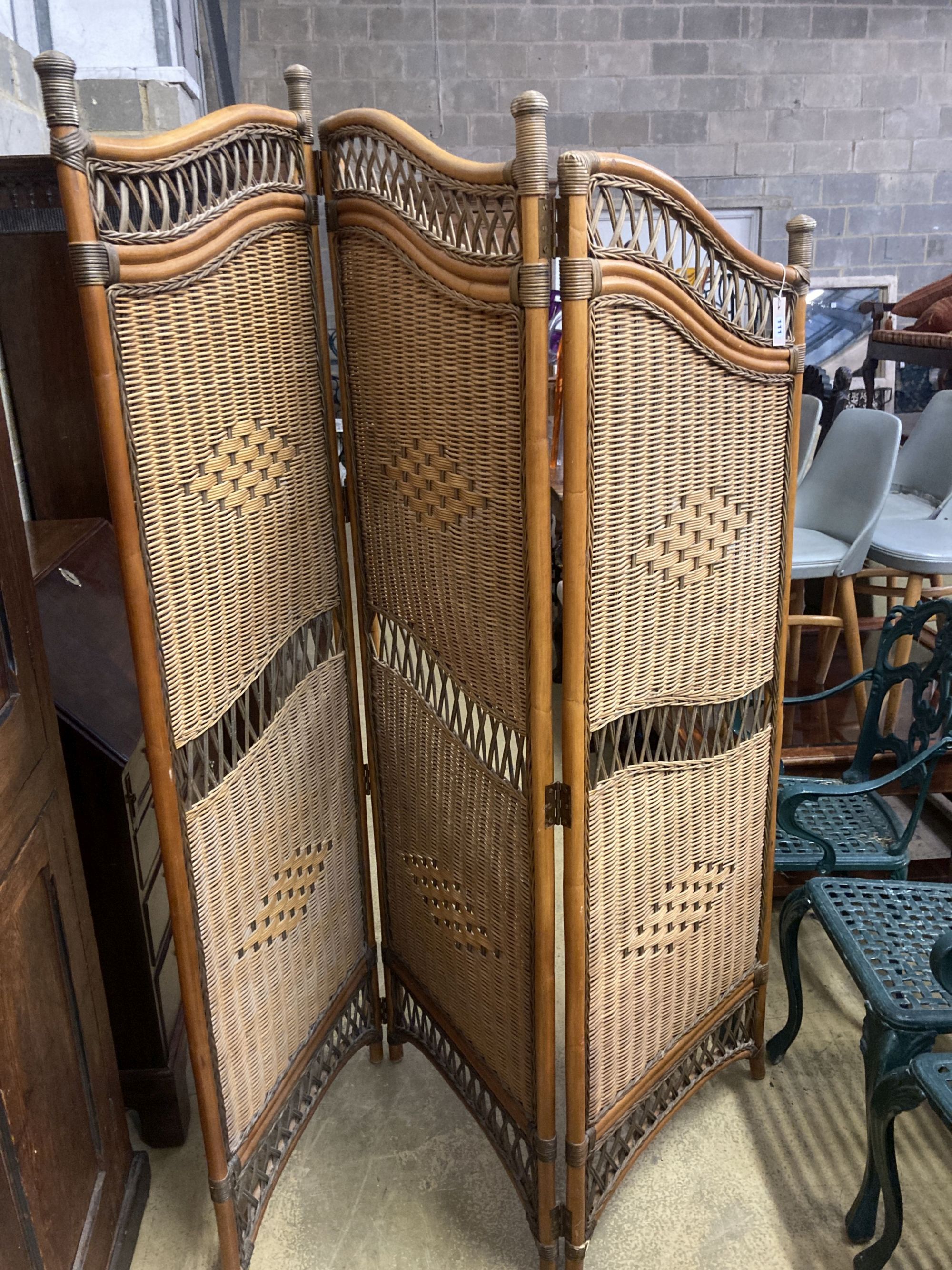 A three fold bamboo and rattan dressing screen, height 186cm